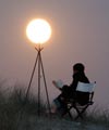 Sabine is reading, lighting by the Moon