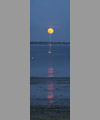 The Full Moon atop a boat mast