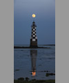 The Full Moon just atop the lightroom of