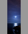 The Moon, Venus and Jupiter are reflecting in the ocean