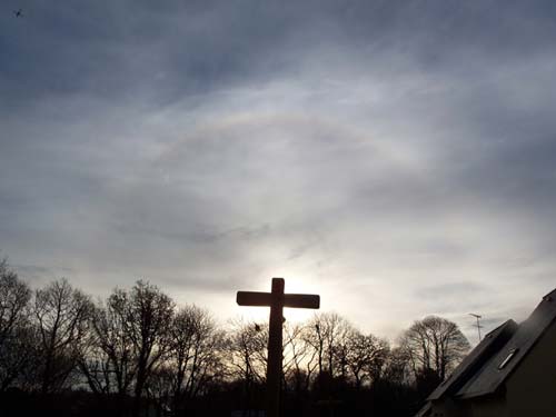 22 degrees halo in a cloudy sky