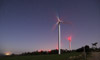 A wind turbine under the stars