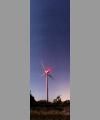 A wind turbine, the Liitle and Big Dipper and Cassiopeia