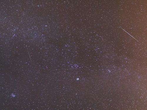 Two Geminids in the Milky Way